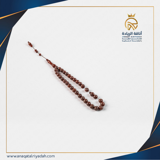 سبحة خشب كوك لون عودي مطعم بالفضة 